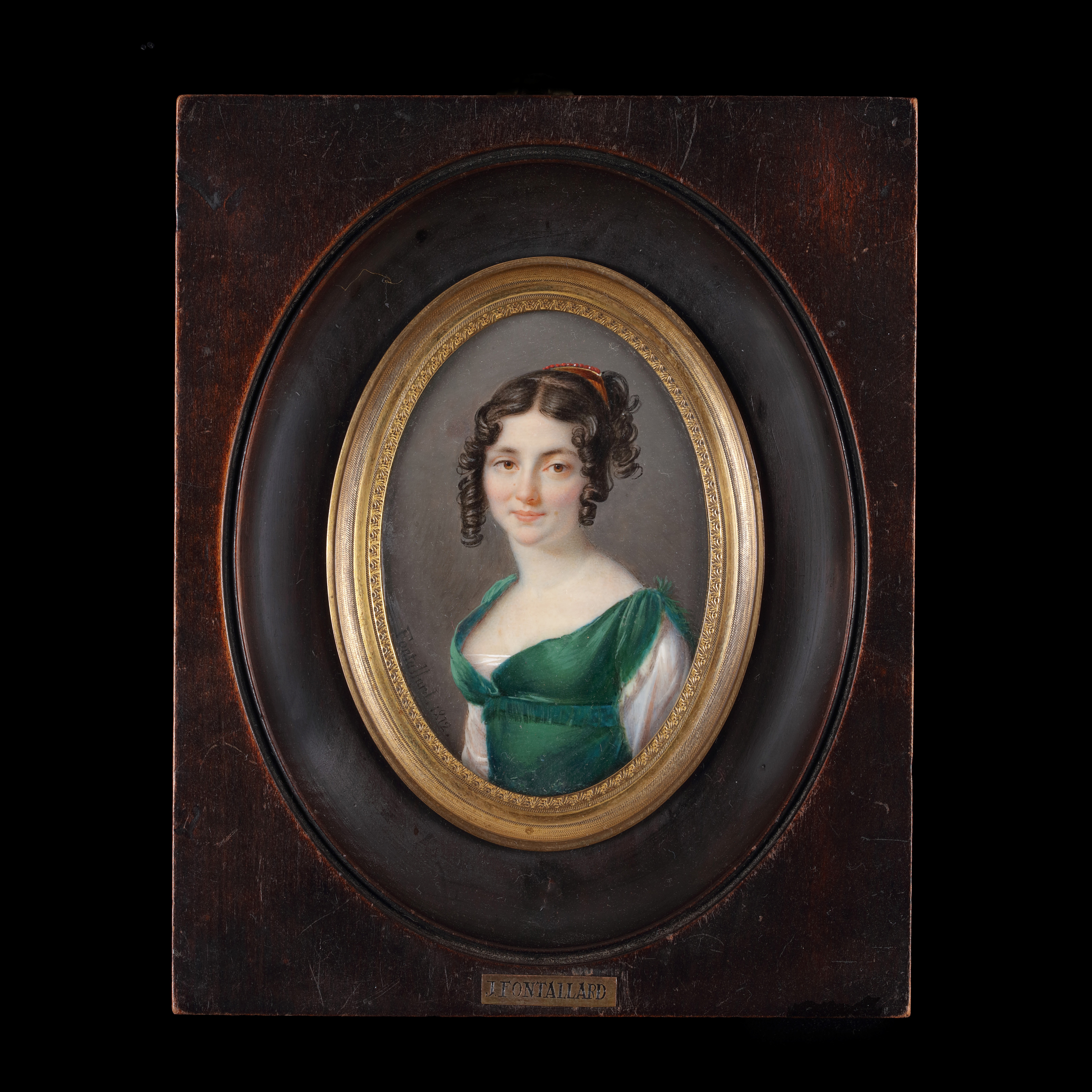 Portrait miniature of Madame Henry Ochsenbein (née Flore Petronille Robert), wearing sleeveless green dress with white underdress, coral studded gold comb in her upswept curled dark hair